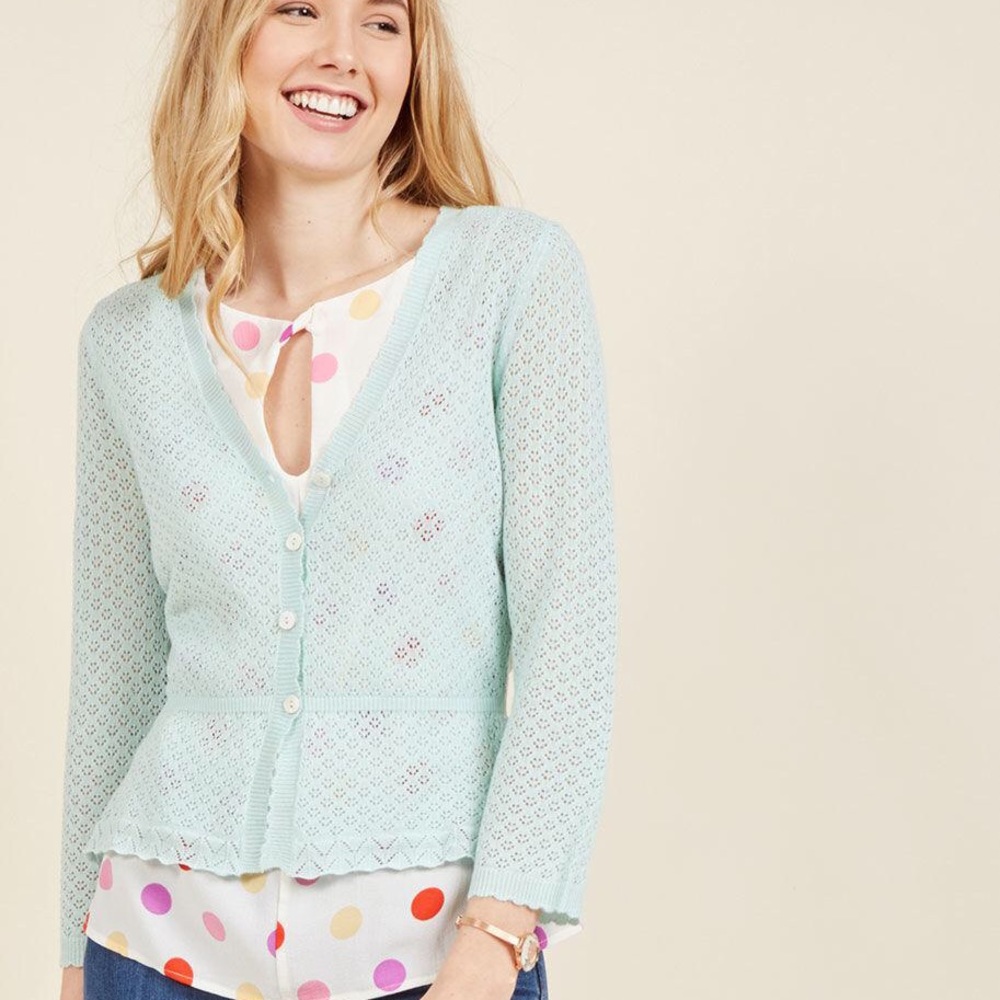Eyelet cardigan with peplum detail